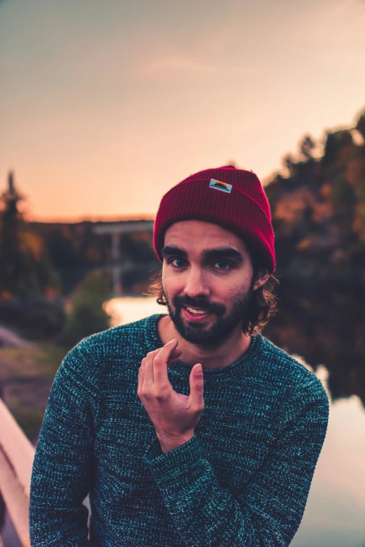 a man making the letter v on his finger