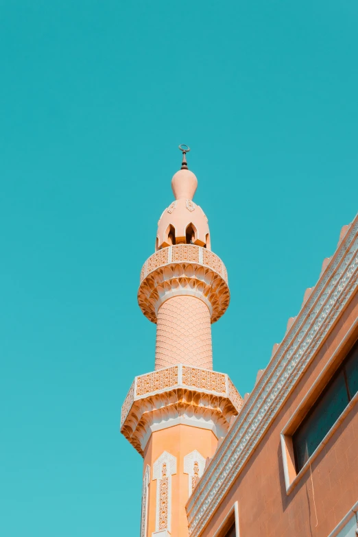 a tall white tower sitting between two buildings