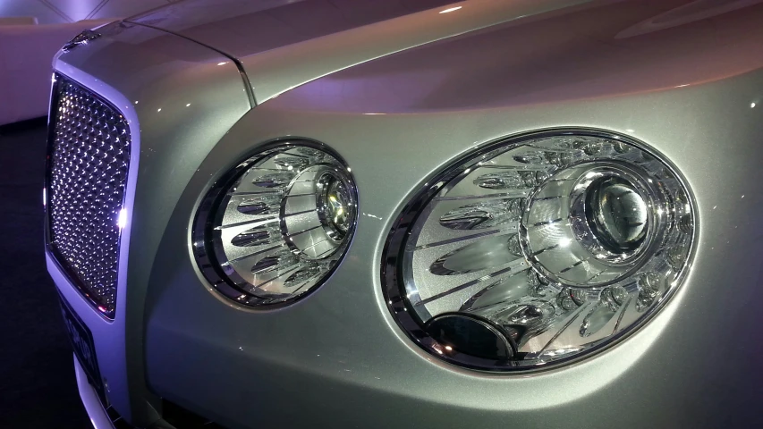 a close up of the front lights of a car