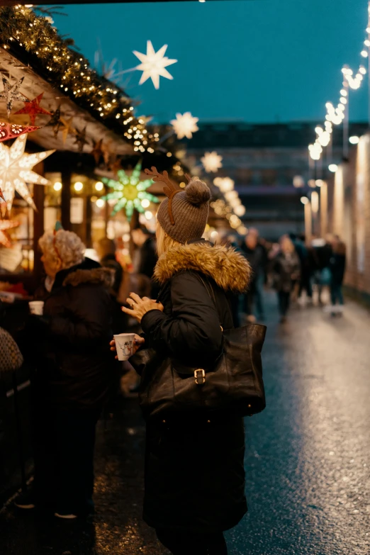 some people walking by the street in a town