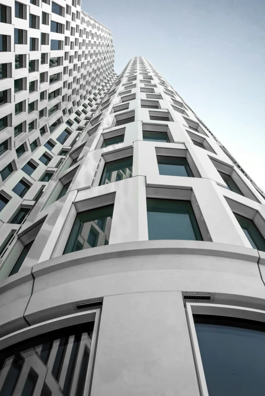 looking up at a modern high rise building