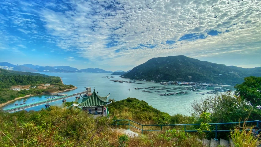 a scenic view of the sea with boats anchored in it