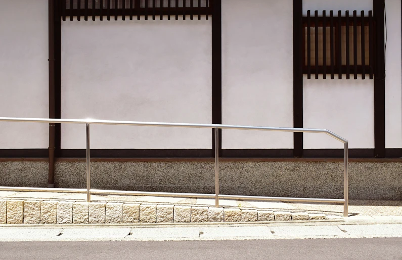 a long metal railing on the side of a building