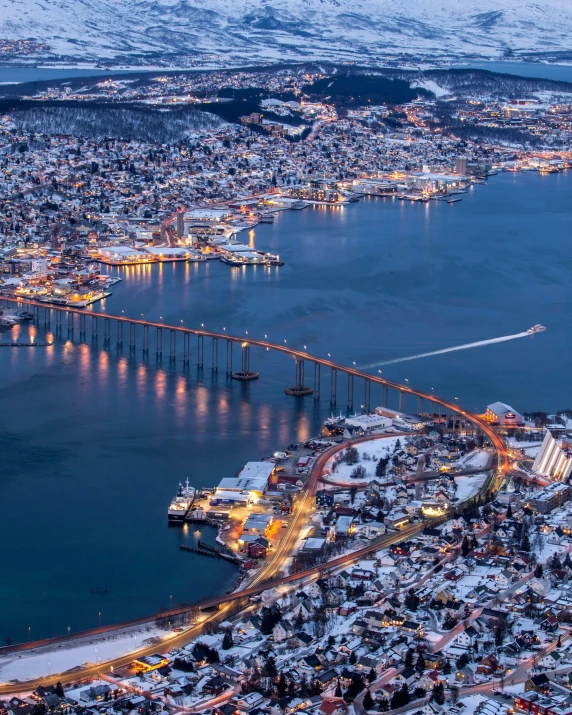 this is an aerial view of the city and its bridge