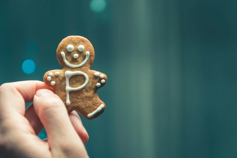 there is a small ginger cookie with the letter p