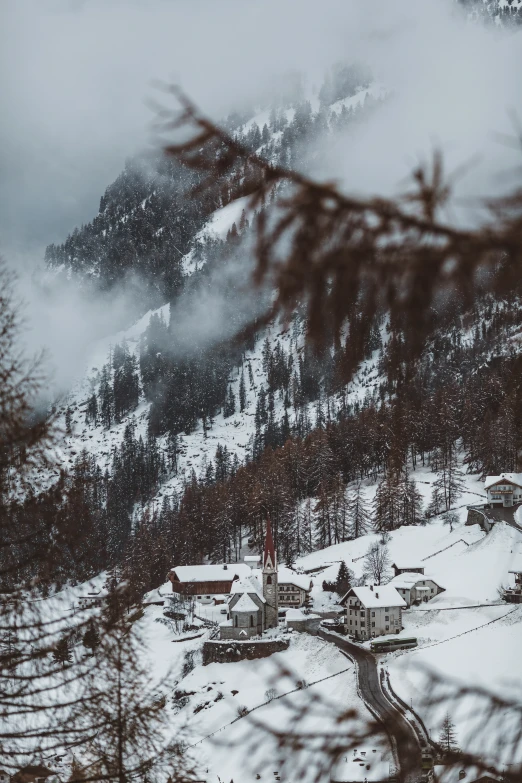 snowy mountains and houses on the slope in winter