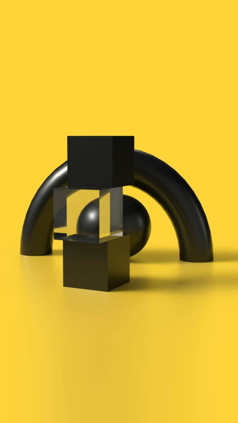 some sort of black sculpture on a yellow surface