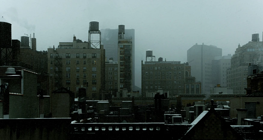 snow falling on the roofs and skyscrs in new york city