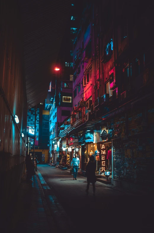 two people walking down the alley at night