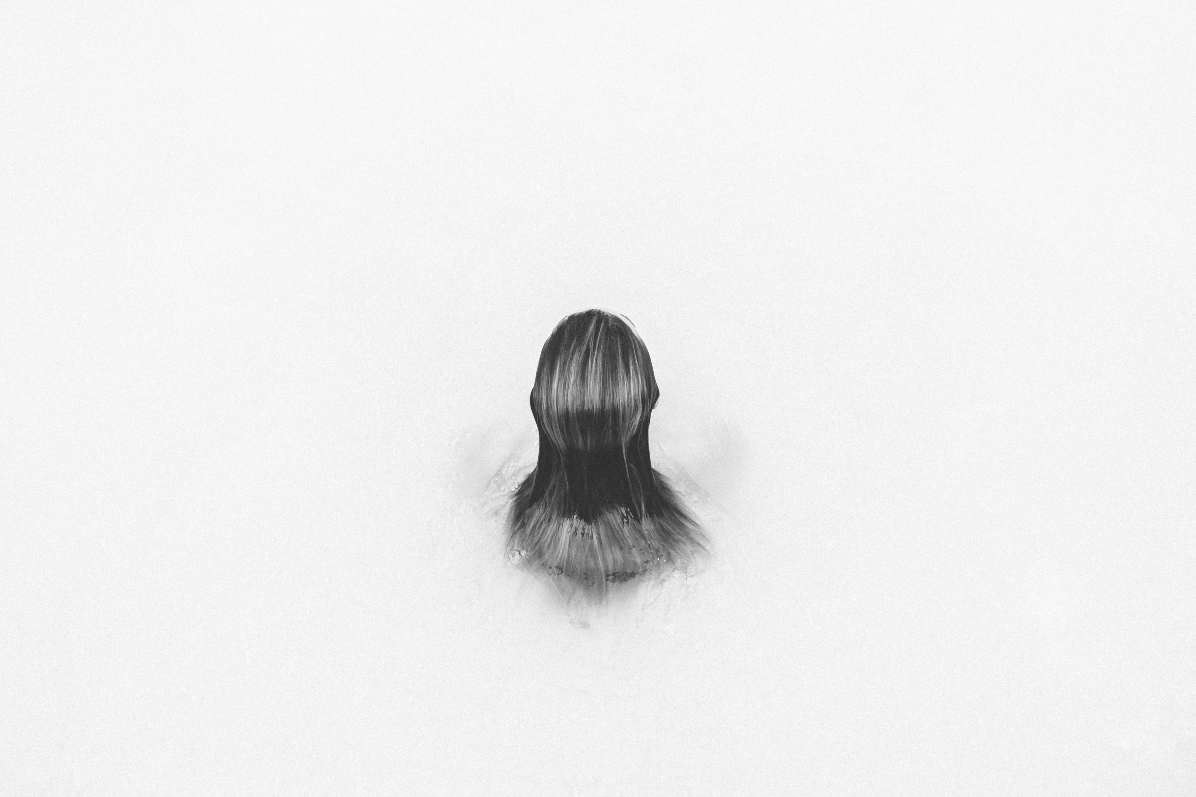 an image of a person in the mist looking up