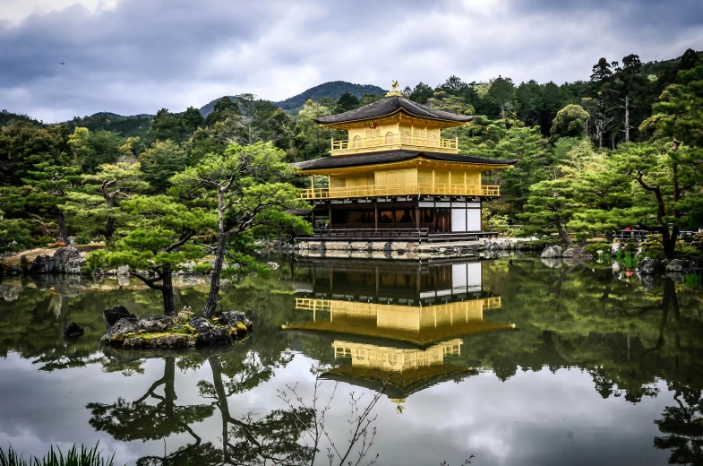 a very big pretty yellow building by some water