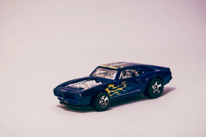 this is a toy car on a white surface