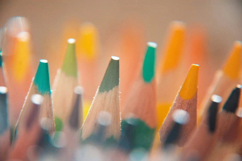 a close up view of several colored pencils