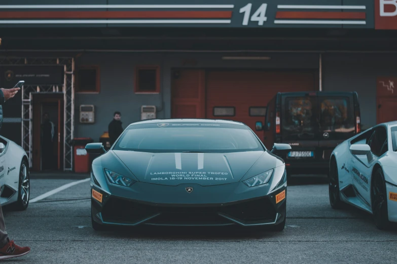 lamb's cars are parked next to each other outside a shop