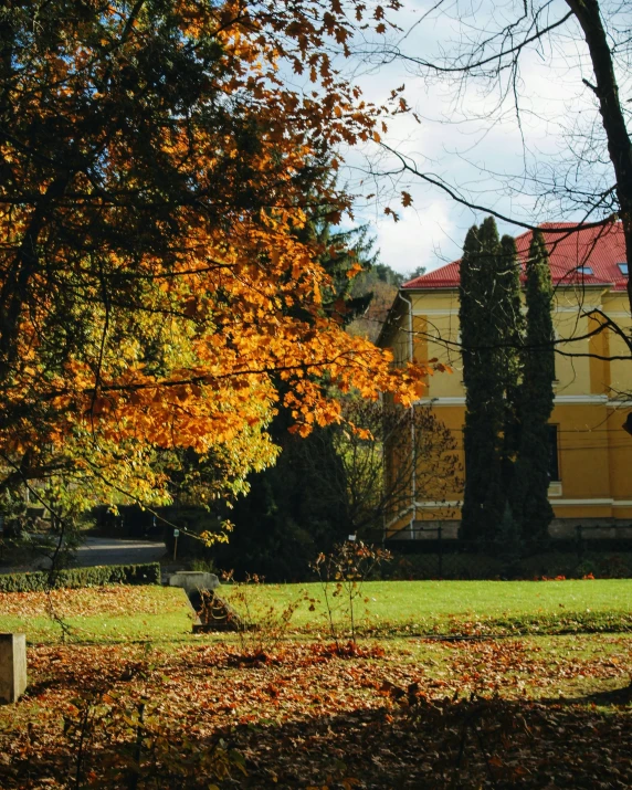 a very old building with trees and grass in the background