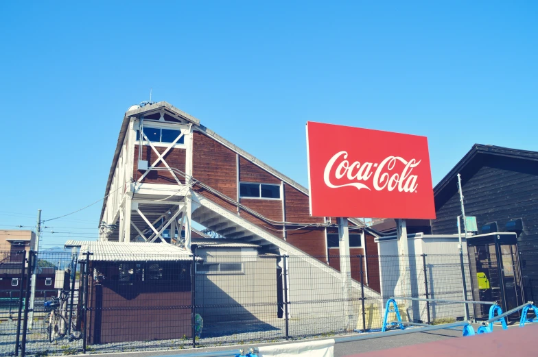 there is a coke sign outside of the building