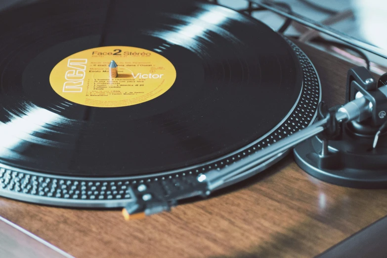 a record player on a wood table top