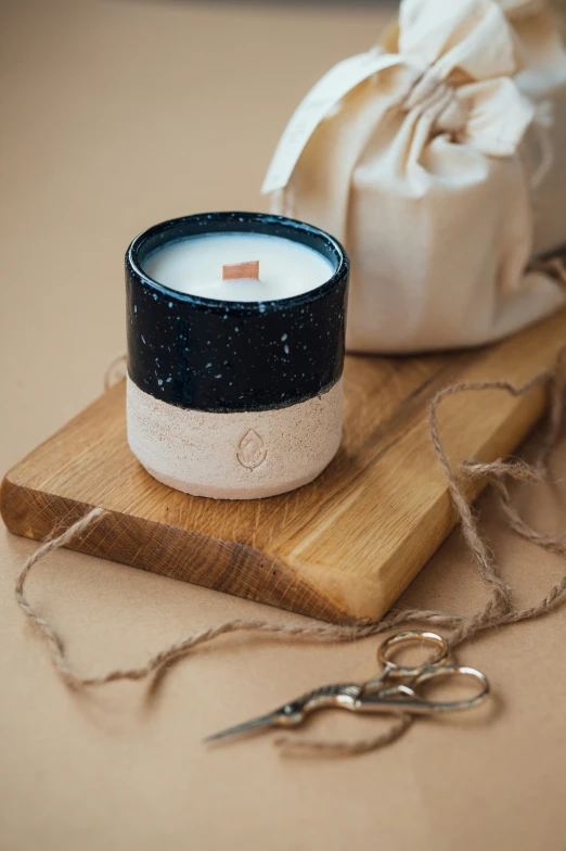 a close up of a candle on a table