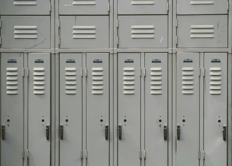 several silver metal lockers with three doors open