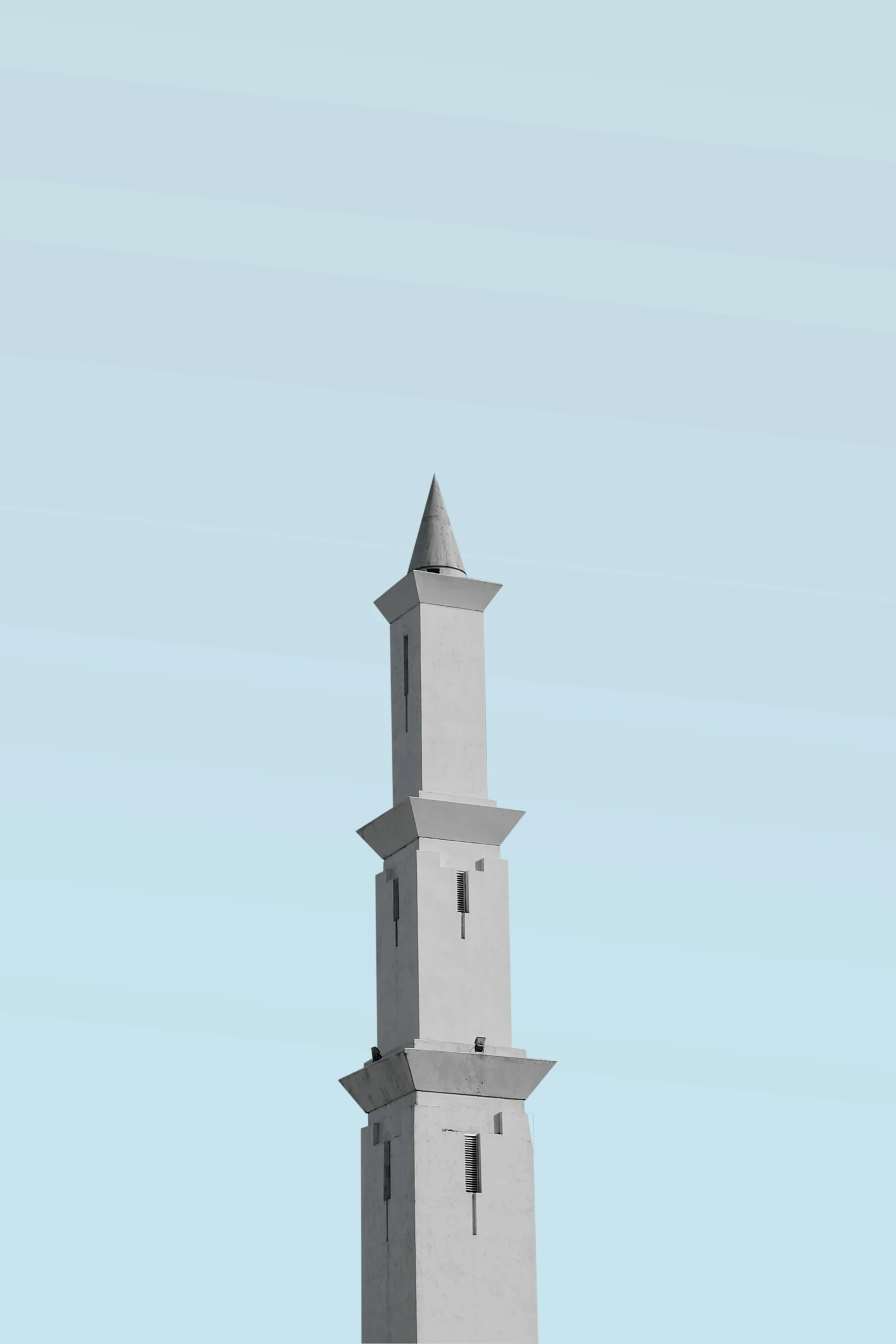 a very tall clock tower sitting against the sky