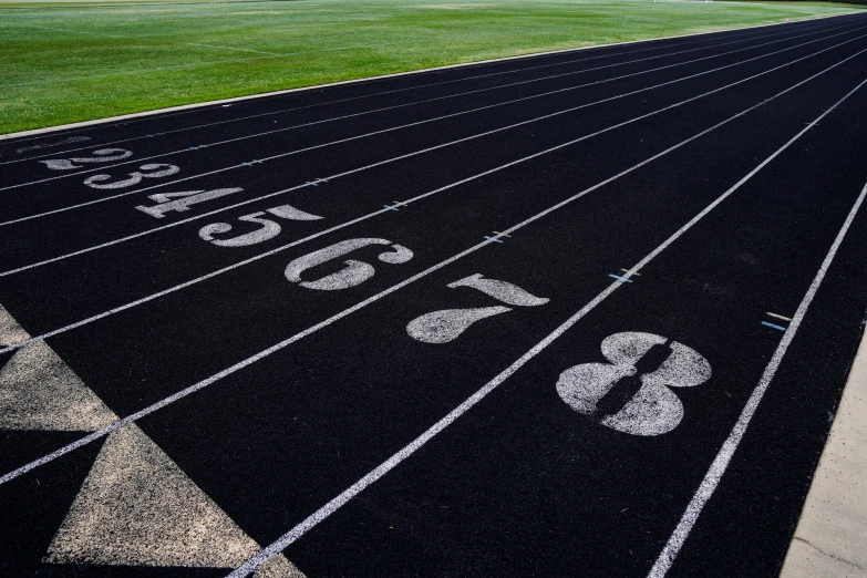 a running track is shown with numbered numbers