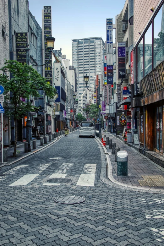 this is an image of a street with cars