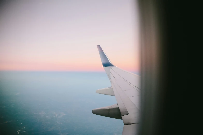 an airplane wing seen from inside a window