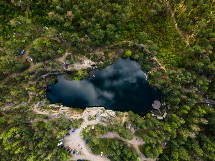 the aerial view of an outdoor park in the middle of the woods