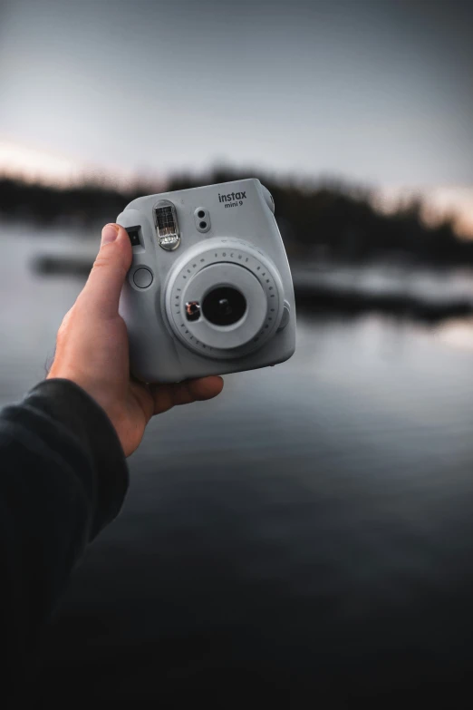 person taking po of landscape with a camera