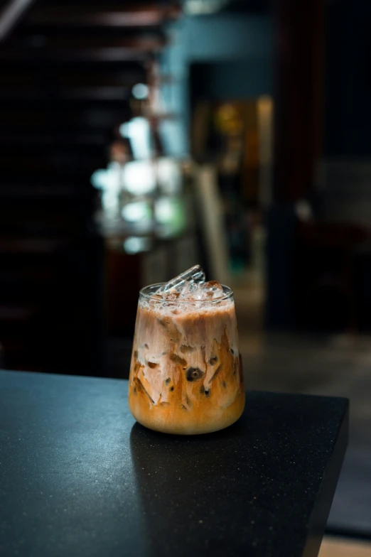 dessert placed on a black table in a restaurant