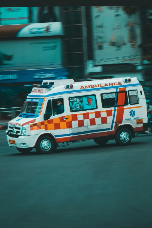 an ambulance is traveling down the road