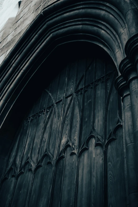 the doorway and wall of the gothic styled building