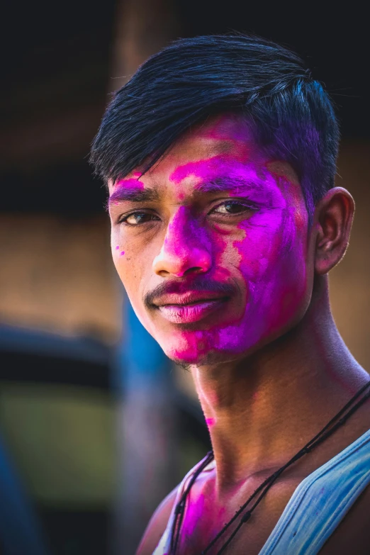 a man with his body painted pink