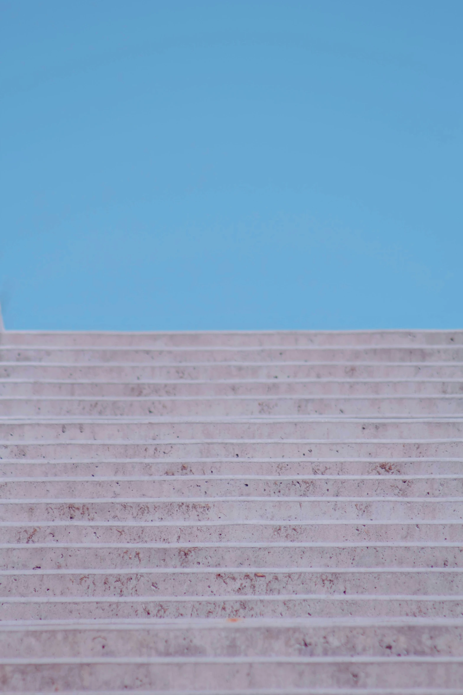 there is a person with an umbrella on the top of some stairs