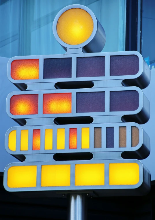 a close up of a traffic light with yellow lights