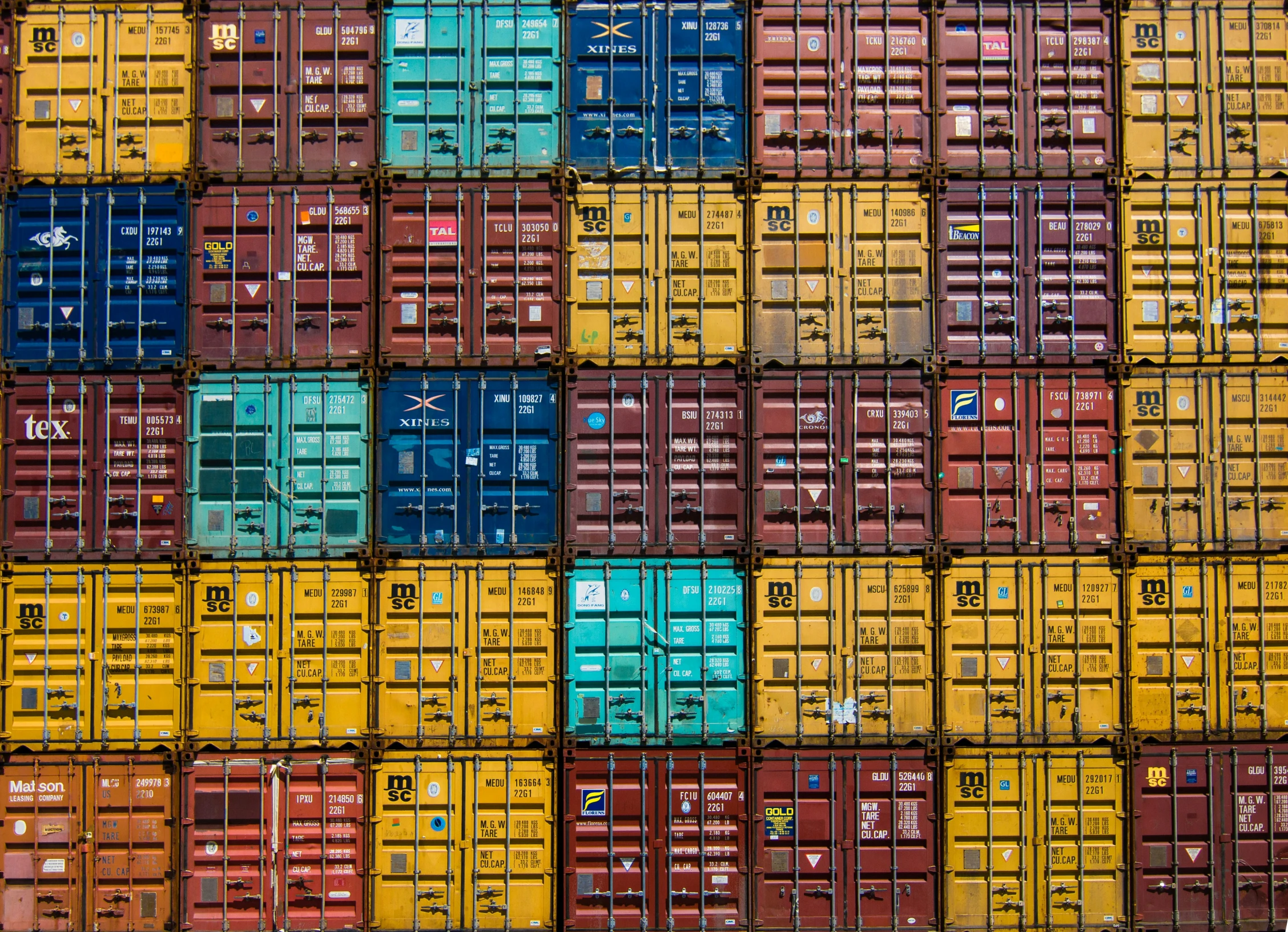 a pile of container units with blue and yellow containers