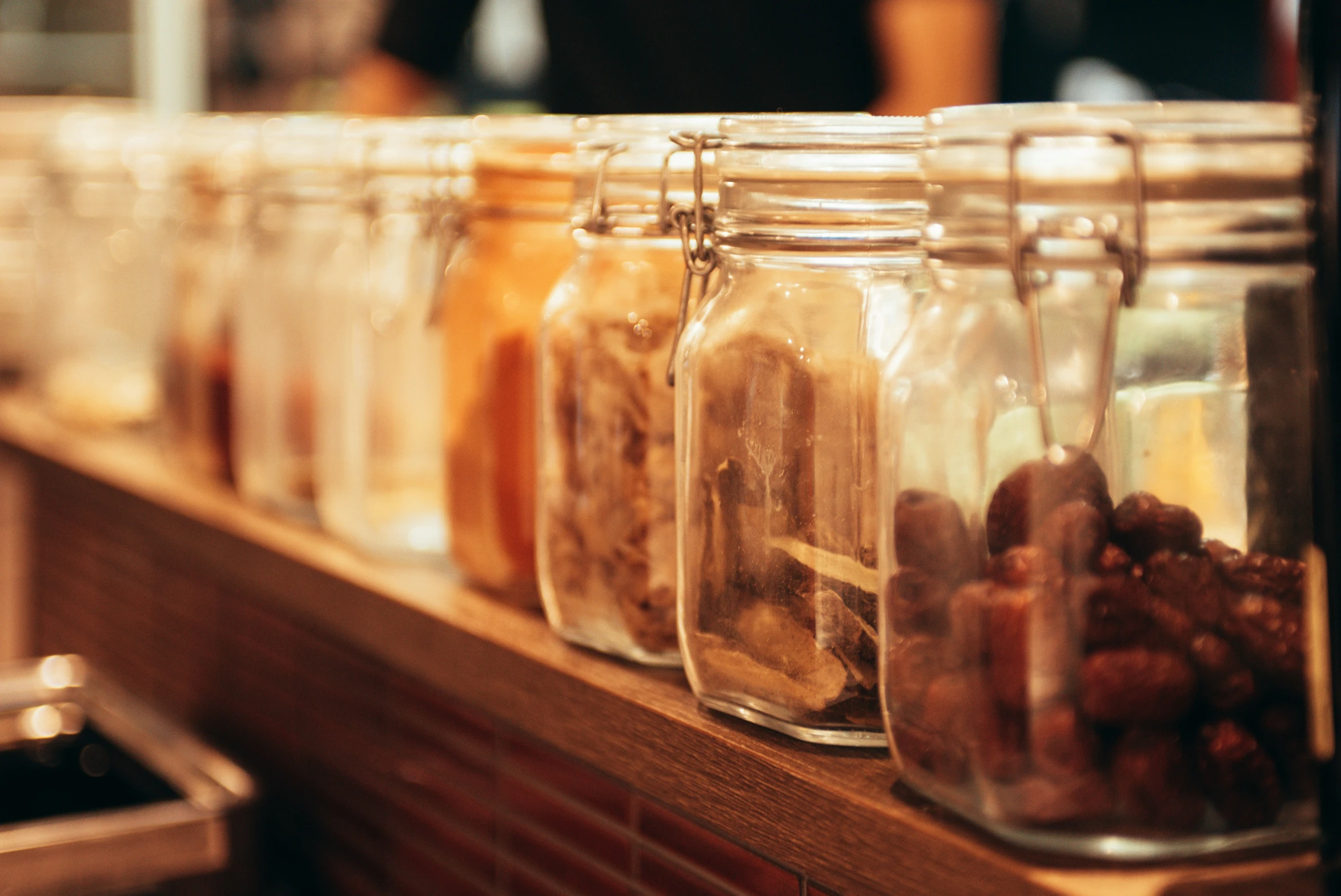 the jar are full of dried berries in different colors