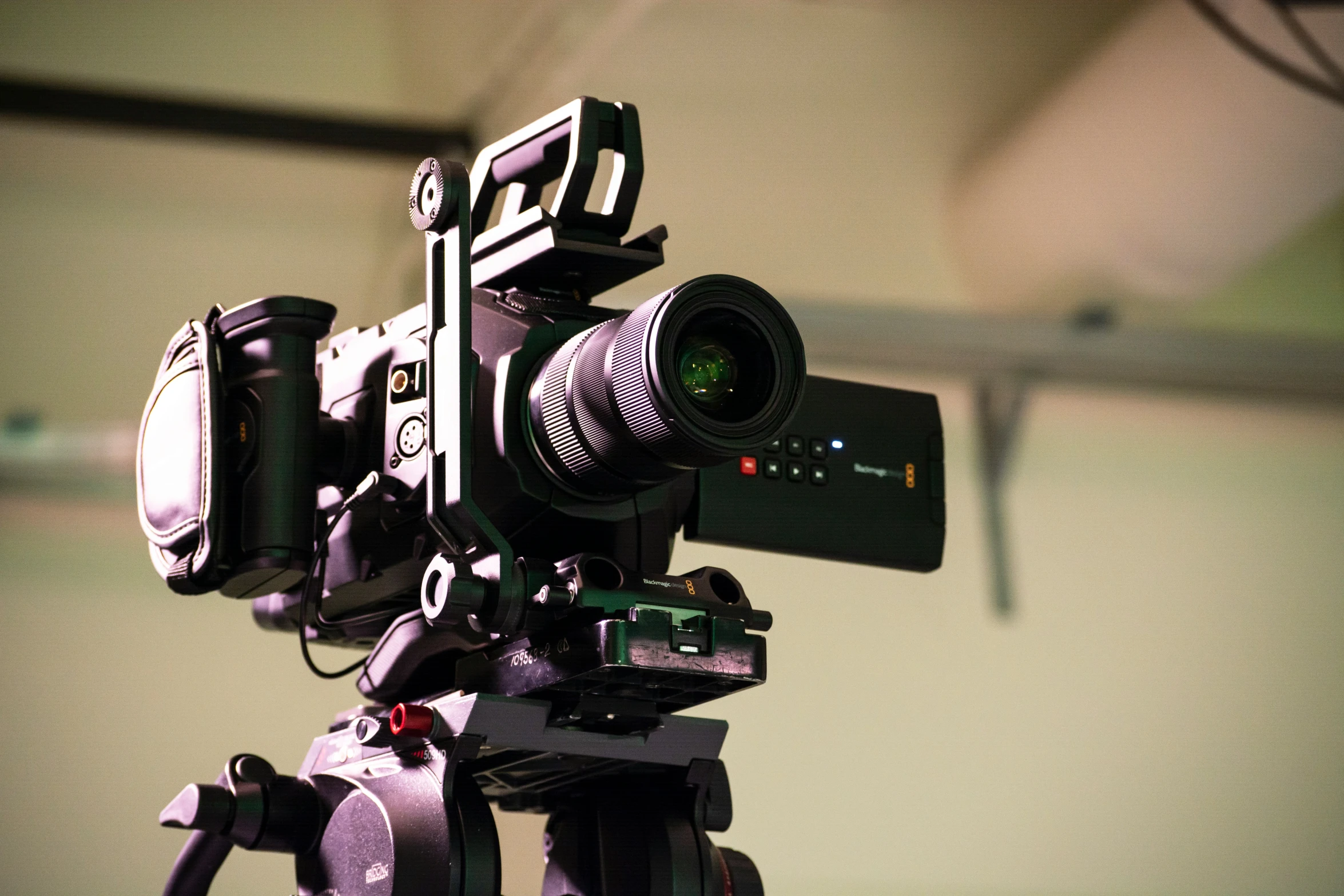 an old film camera sitting in front of a laptop