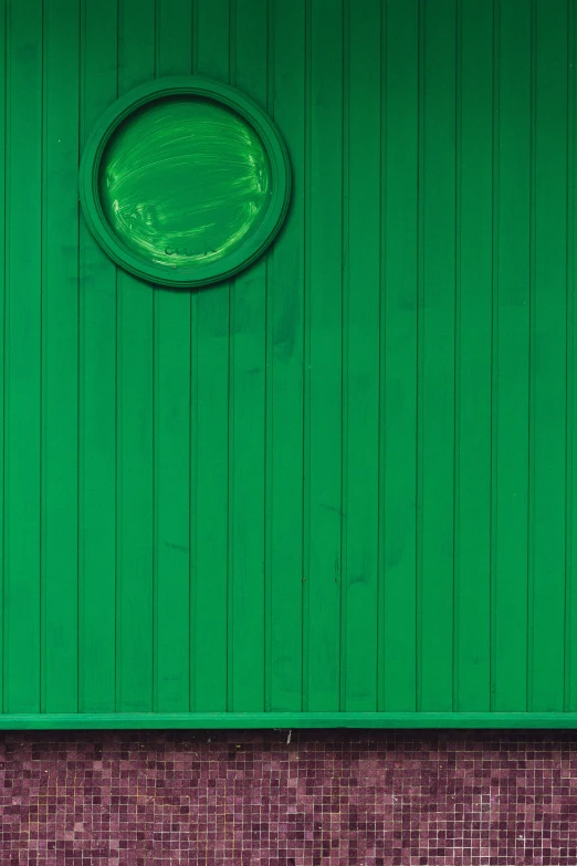 the top half of a green colored building