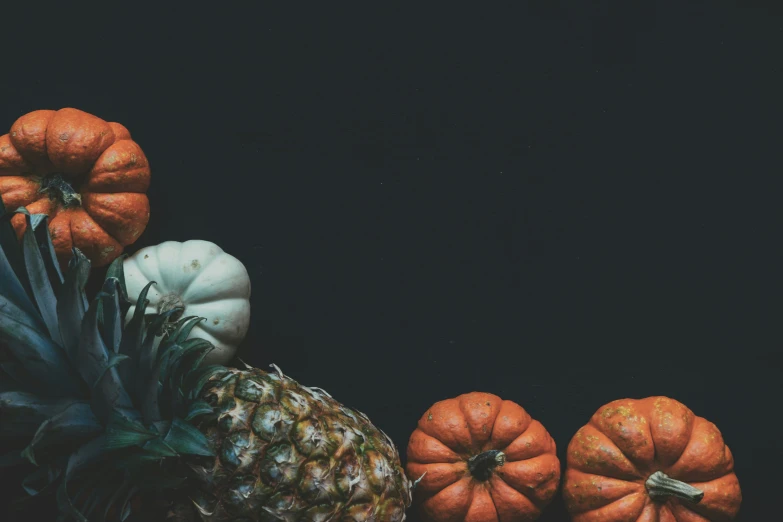 a group of different types of fruits including pineapple