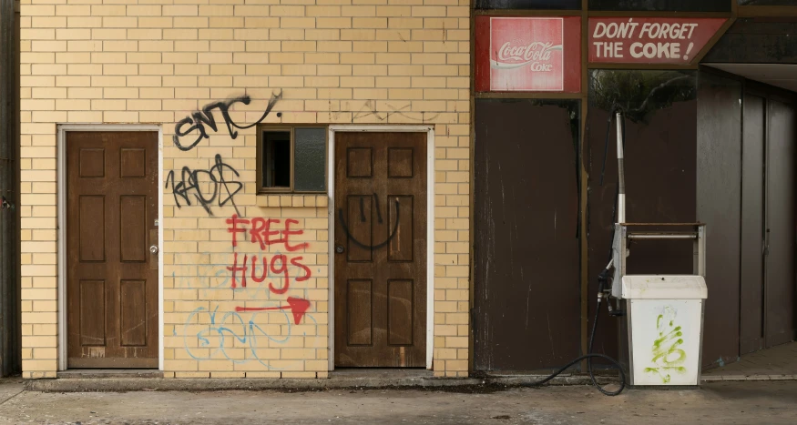 graffiti writing on a yellow brick building