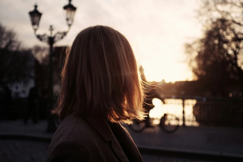 a woman looking out over a street