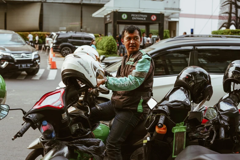 an image of a man sitting on a motorcycle