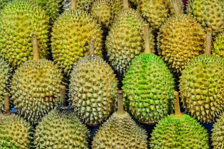 a pile of yellow fruits stacked on top of each other