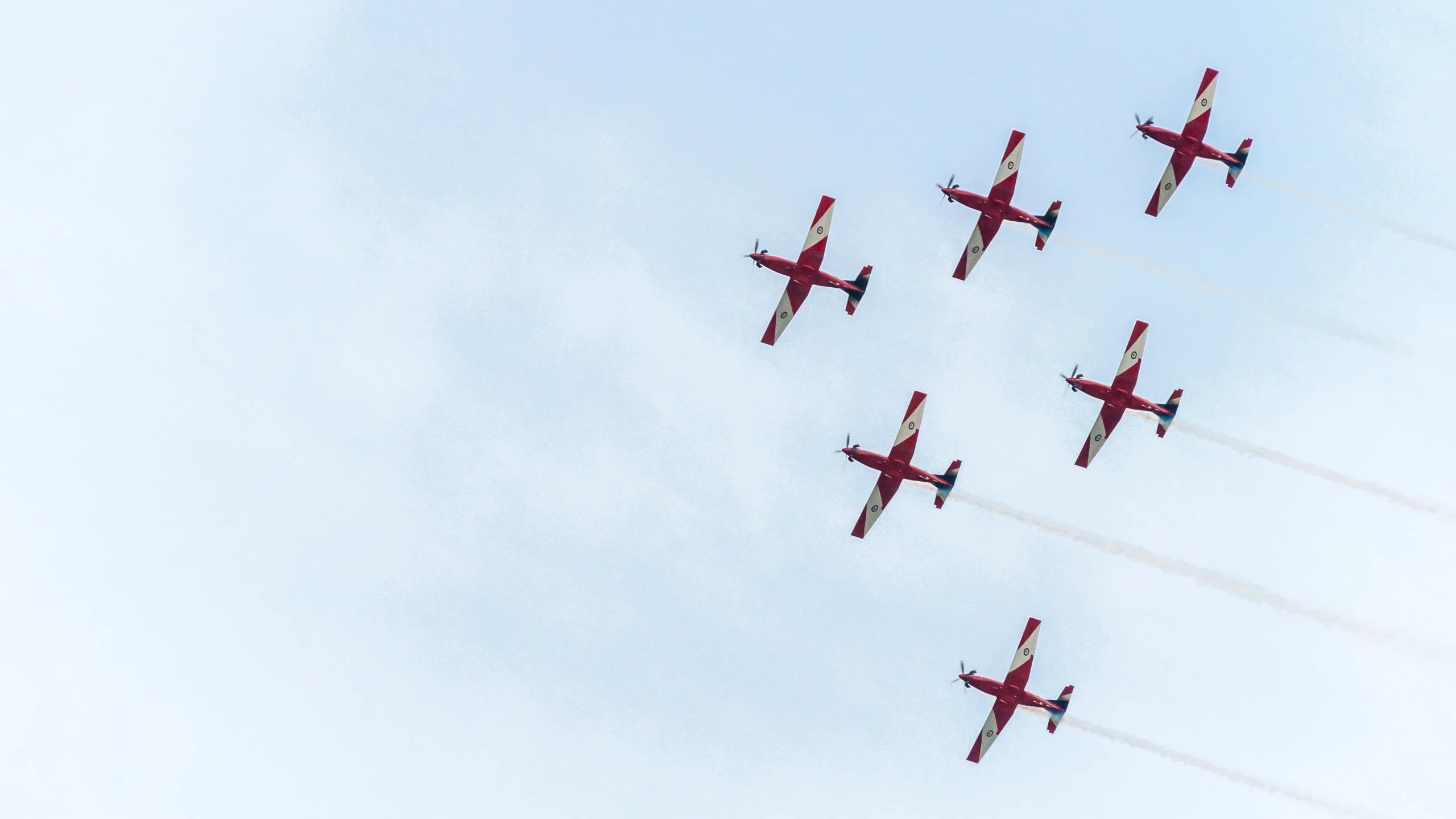 a number of planes flying in the sky