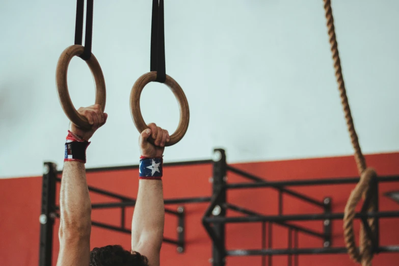 a man is on ring rings above a bench