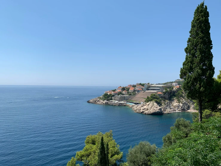 a bay with several houses near it and trees