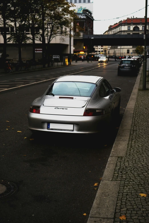 car parked on the side of the road at dusk