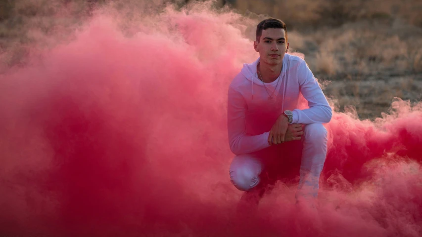 a person that is standing in front of a pink substance