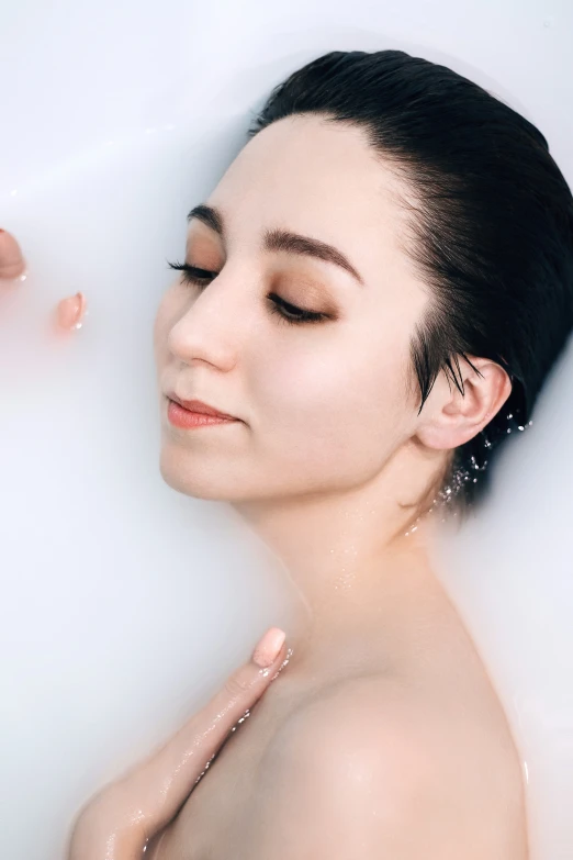 a close up of a woman in a bath